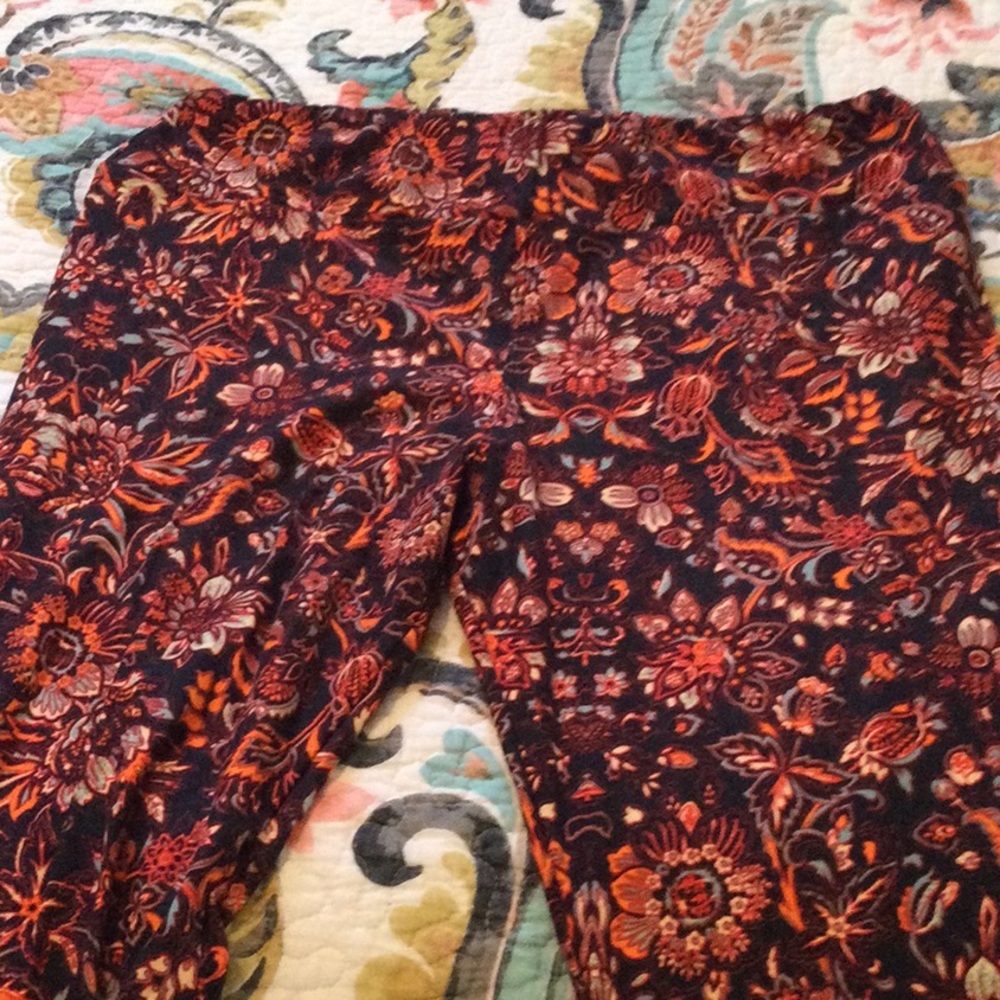 Brand new Lularoe Leggings, Size TC. Black with Floral pattern in orange, blue
